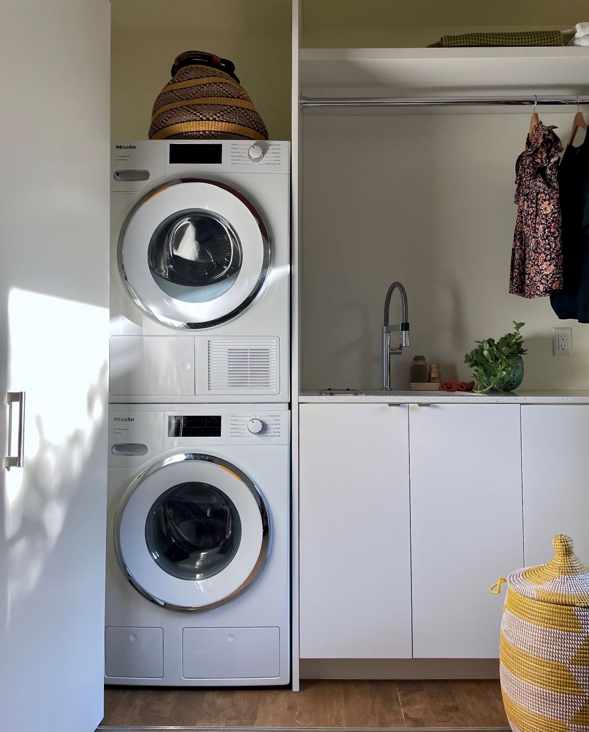 Laundry room featuring Miele washer and dryer