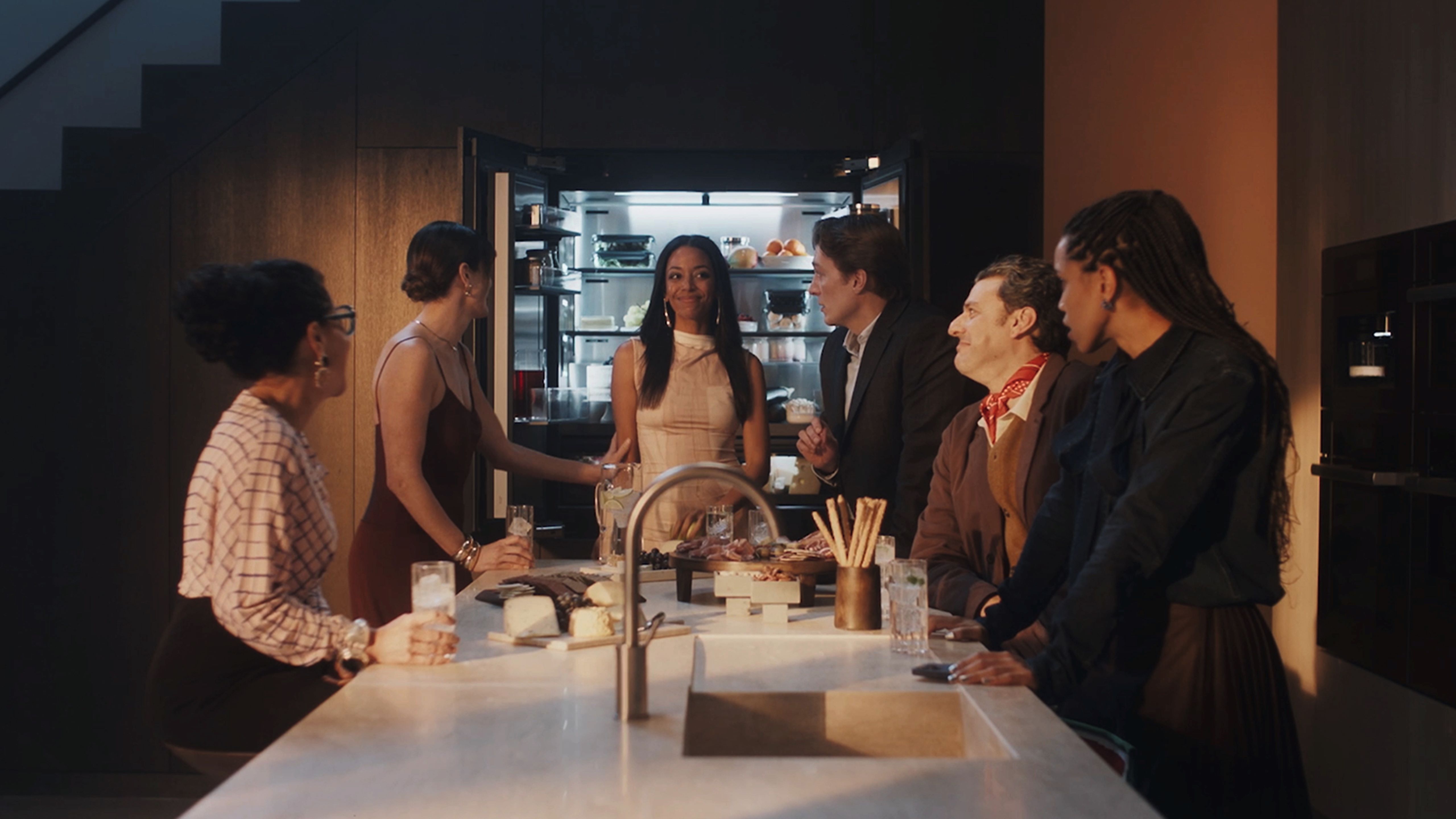 people standing in kitchen
